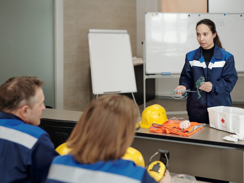 Occupational safety instructor explaining how to give first aid